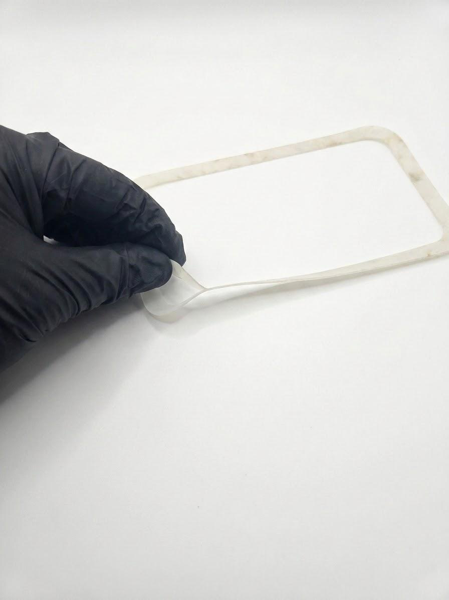Place the extender gasket on the bottom enclosure.