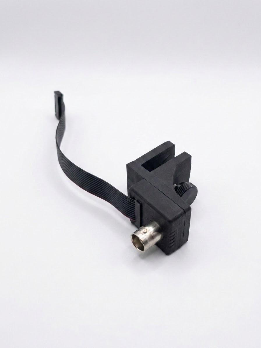 Trigger cable adapter: ribbon connector to SMA.